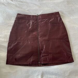 Faux Leather Zip-Front Mini Skirt in Burgundy